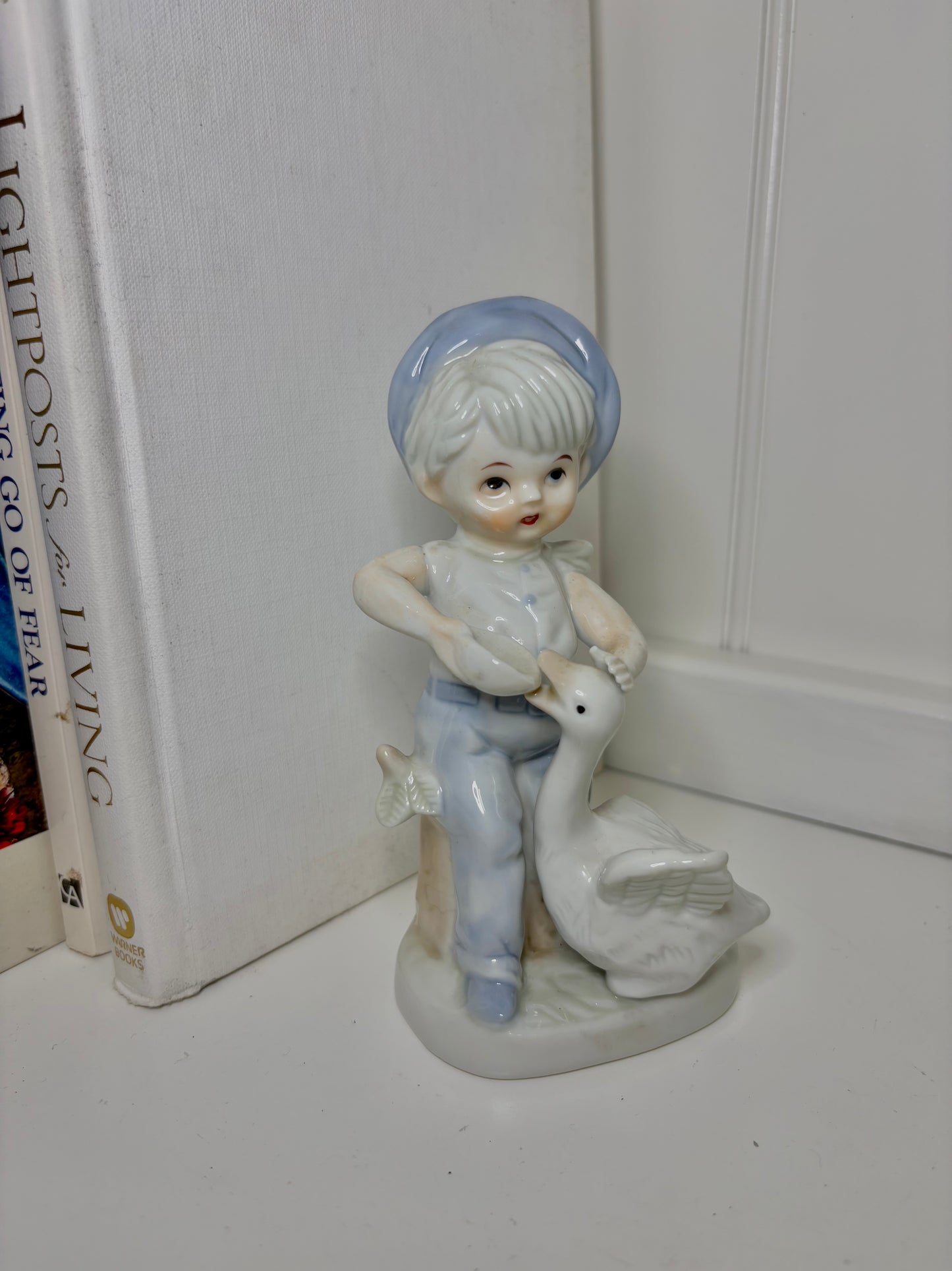 Kid Feeding Goose Porcelain  Figurine